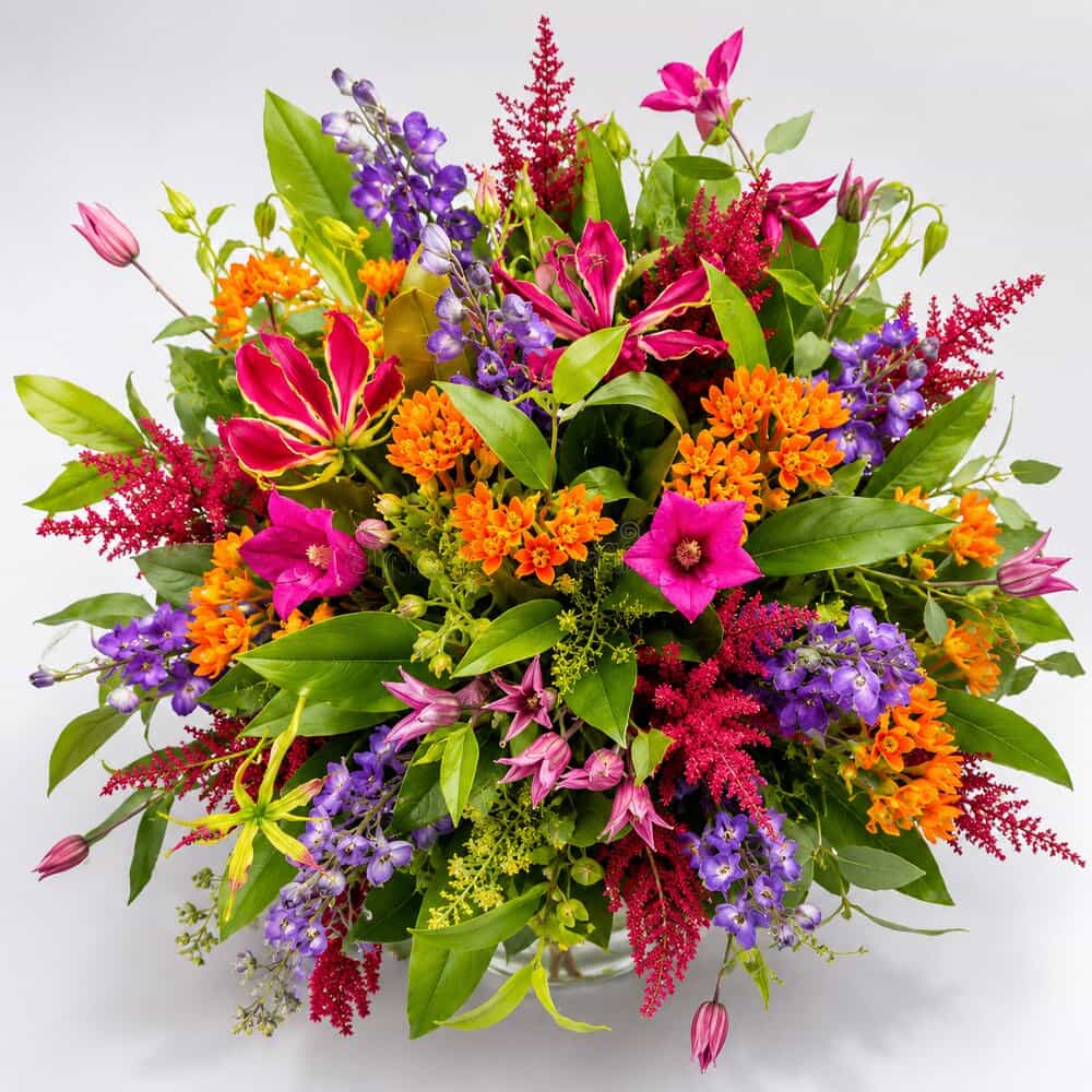 Vida – Bunter Sommerstrauß mit Gloriosa – Blumenstrauß vom Münchner Floristen